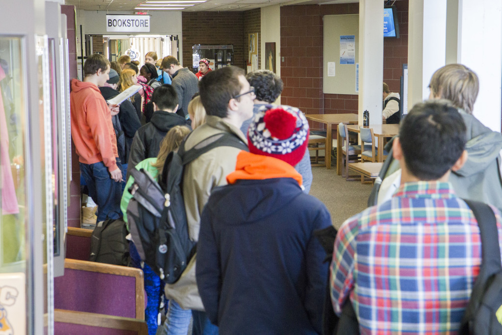 Students wait in line for books at the Campus Store in January 2016. Bookstore frustrations continue for students today. 